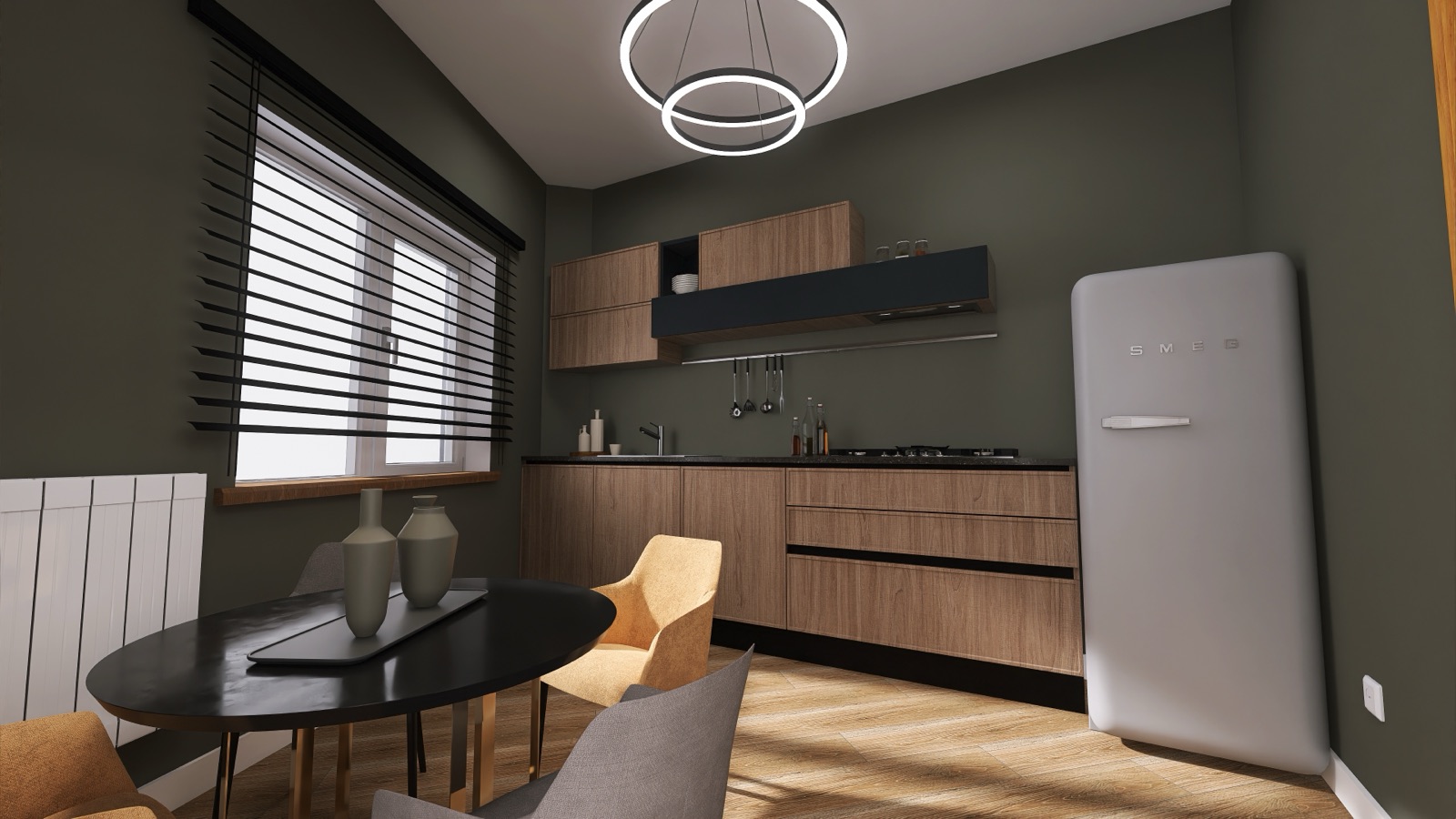 Cucina verde oliva con pensili in legno, tavolo nero e lampade circolari